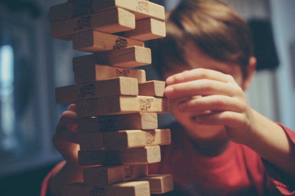 child playing Jenga